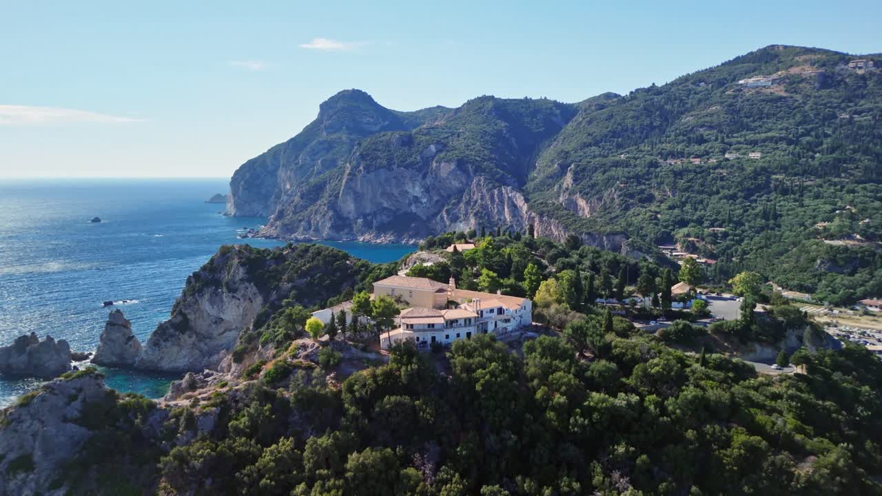 Aerial view of coastal cliffs and sea, peaceful escape at sunset