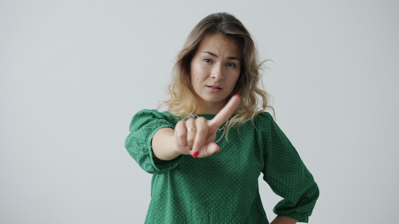 Woman pointing finger disapprovingly