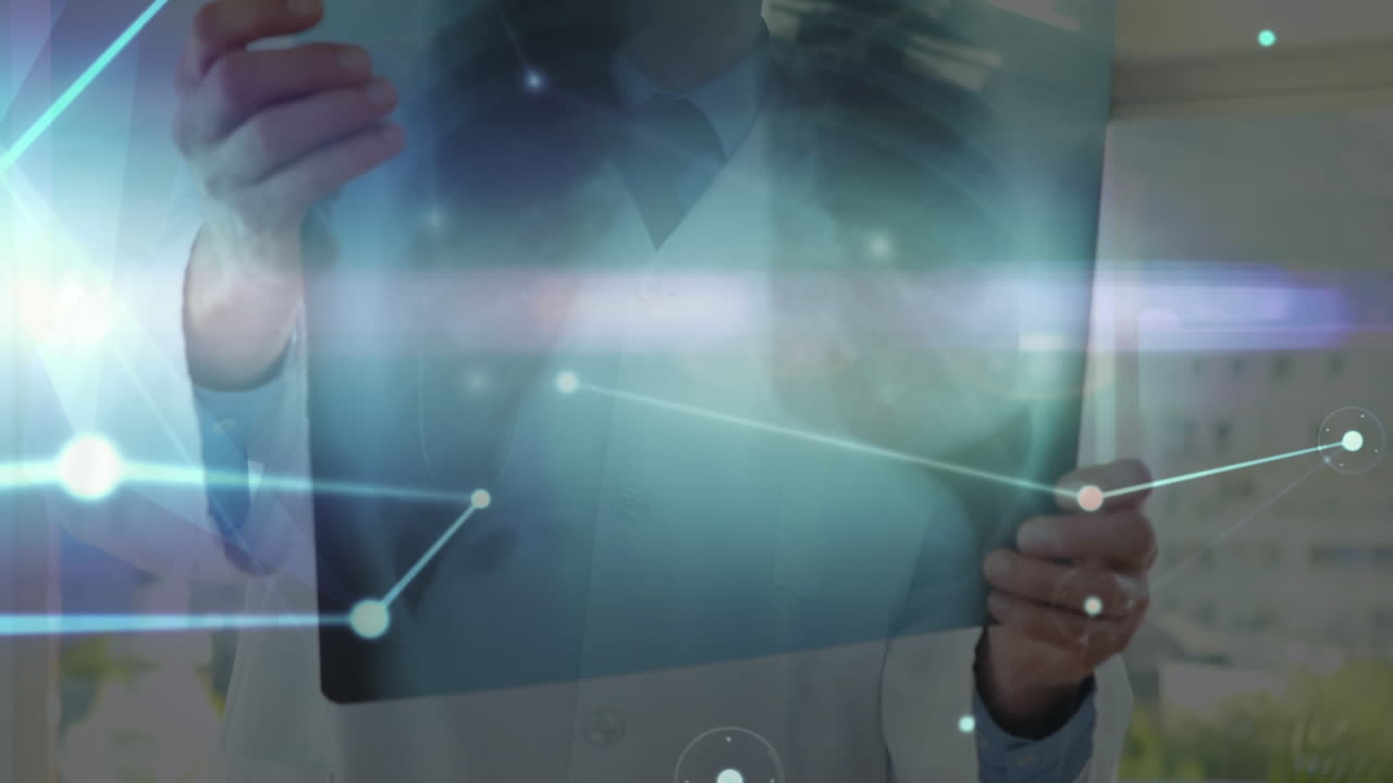 Animation of network of connections over hands of caucasian male doctor with x ray photo