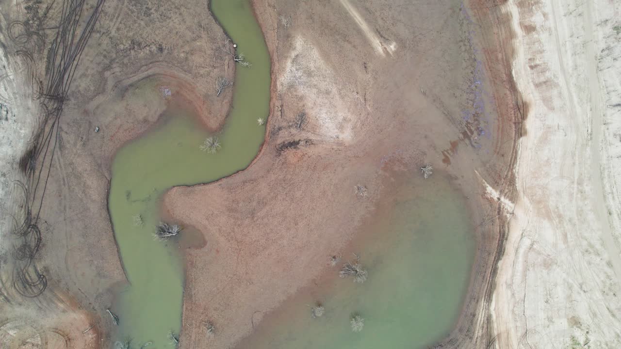 Vertical drone footage of the Burnt Creek inlet on Lake Eildon, near Mansfield in central Victoria, Australia. The storage was 61% full. April 2025.