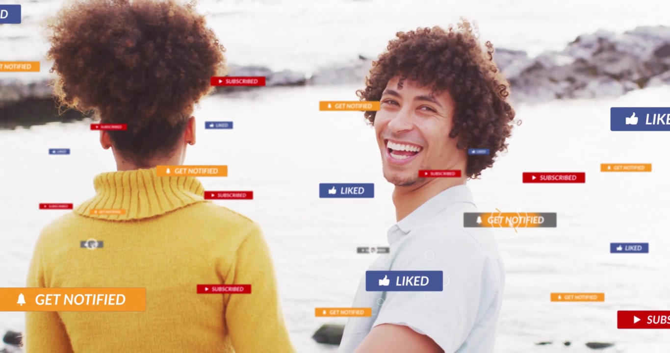 Couple on rocky shore initiating social media icons appearing around them and driving engagement