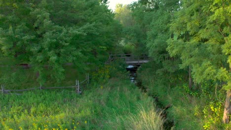 bridge-over-Hathaway-brook-to-the-sacred-grove-near-the-Joseph-Smith-family-farm,-frame-house,-temple,-visitors-center,-in-Palmyra-New-York-Origin-locations-for-the-Mormons-and-the-book-of-Mormon