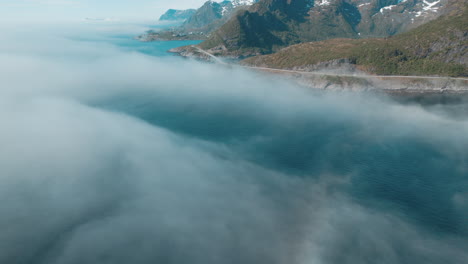 Djupfjord-Bridge-in-Moskenes,-Lofoten-Islands:-Aerial-View-in-a-Sea-of-Clouds