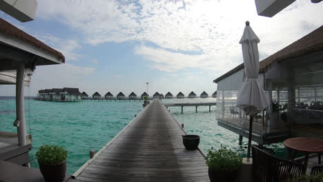 walking with bungalow in ocean sea at maldives