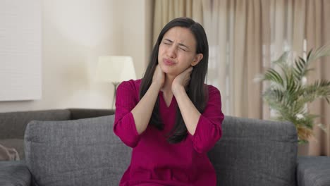 sick indian woman suffering from neck pain