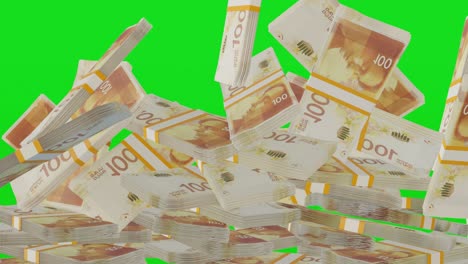 크로마키의 배경에 떨어지는 많은 돈의 어리, 100 이스라엘 셰 지폐, 돈의 더미.