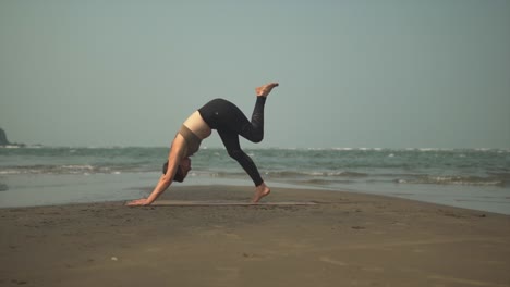 yoga exercise on the beach