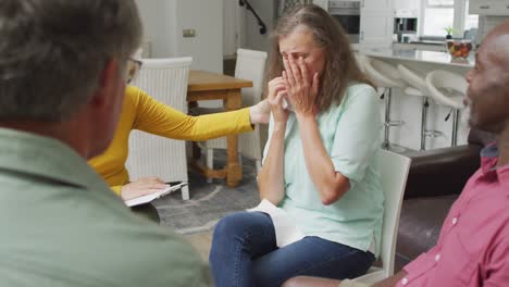 animation of caucasian senior woman crying during support group meeting