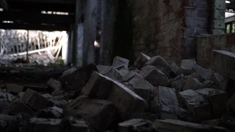 pile of bricks rubble in abandoned building panning shot