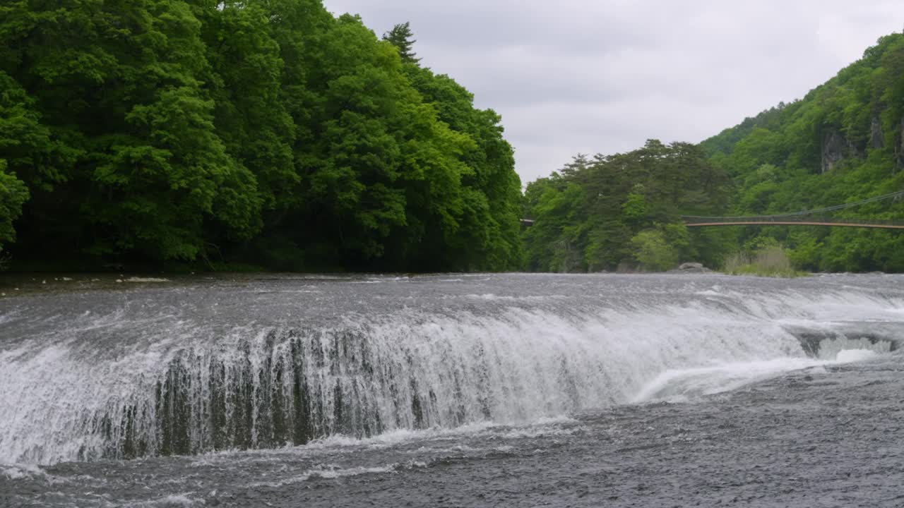Slow motion panning shot over Fukiware waterfalls in Gunma, north of Tokyo