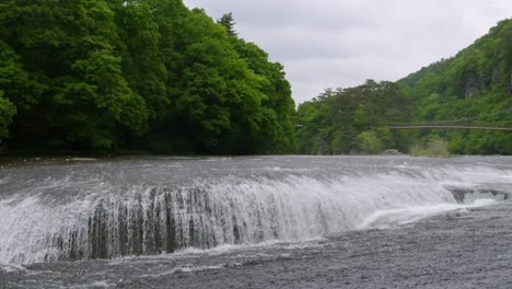 slow motion panning shot over fukiware waterfalls in gunma, north of tokyo