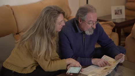 aged couple with map planning tourist route