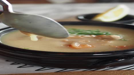 bowl of creamy soup with vegetables