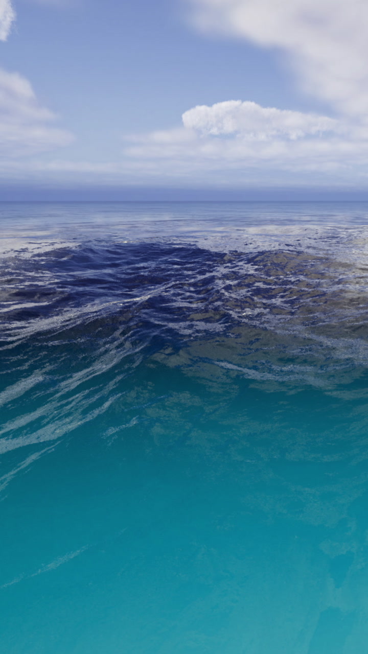 Waves dancing in the sunlight above crystal clear turquoise water