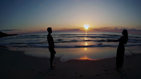 sunset beach couple silhouette