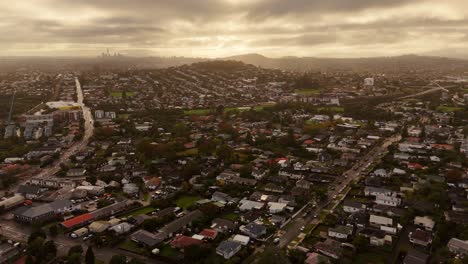 orbit shot of famous auckland, avondale area at sunset time, new zealand