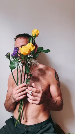 man with flowers and cigarette