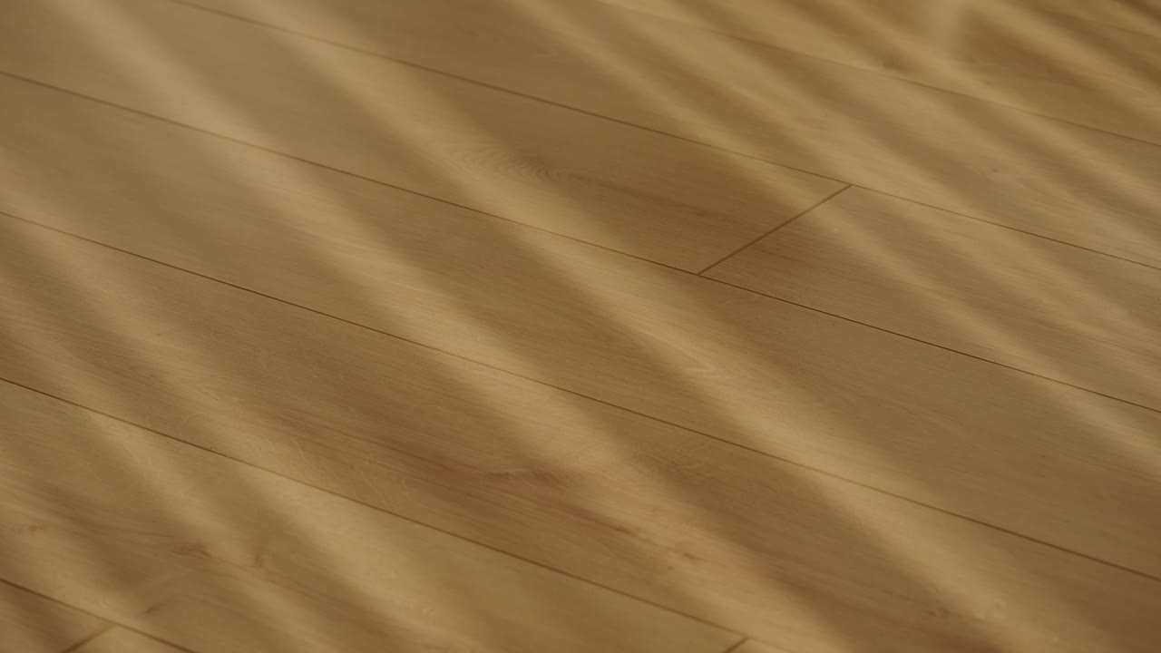Wooden floor with sunlight shadows