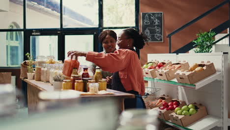 retailer gives food samples to her customer in zero waste store