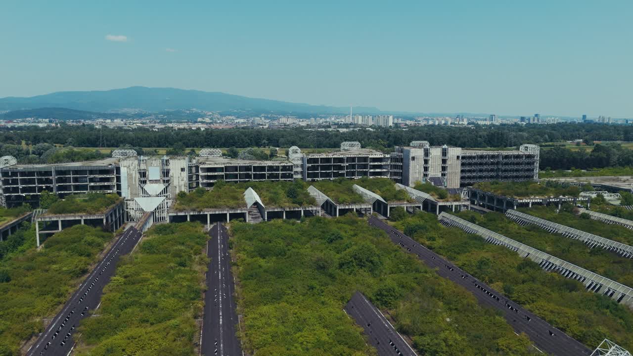 abandoned Blato hospital covered in greenery facing distant Zagreb and mountains