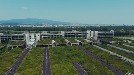 abandoned blato hospital covered in greenery facing distant zagreb and mountains