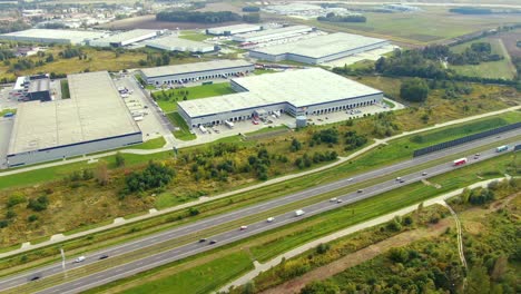 aerial view of logistics center, warehouses near the highway