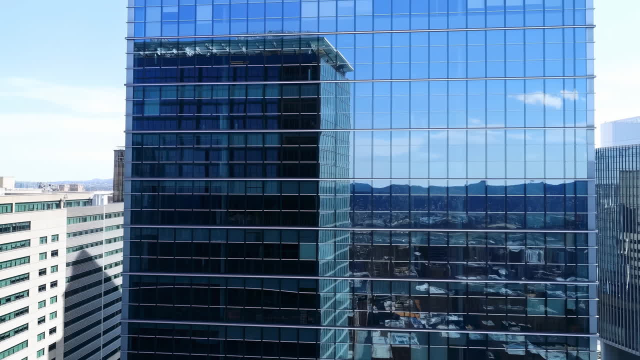 Glass Skyscraper Reflecting Blue Mountain Skyline, Panoramic Exterior Of Corporate Headquarters With Mirrored