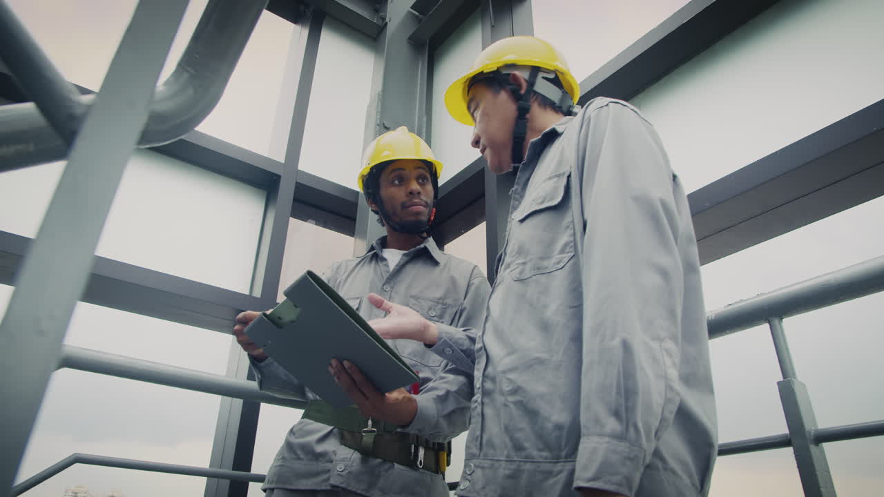 Foreman Explaining Builder Plan of Renovation