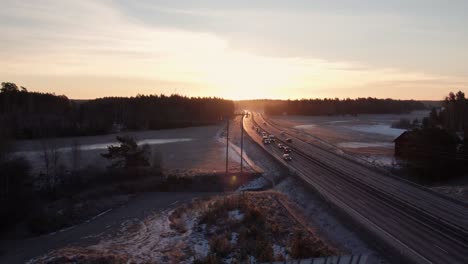drone view solar panels passing by with the sun in the back