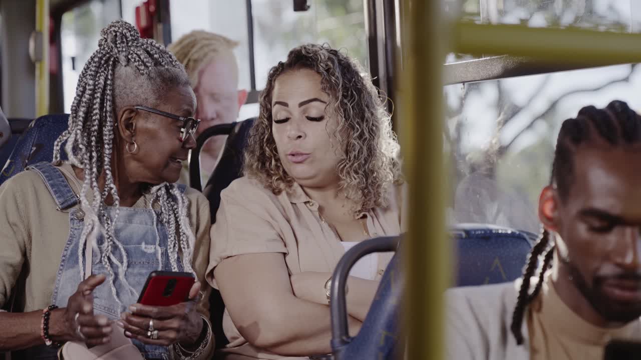 People conversing and commuting on a public bus