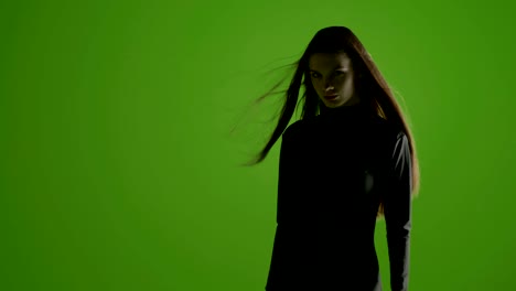 young stylish fashion model shoot in professional studio over a green screen - shoot with blacmagic urssa mini in prores