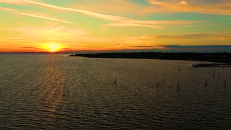 aerial view. kite surfing on the blue sea in the background of beautiful clouds. sunset