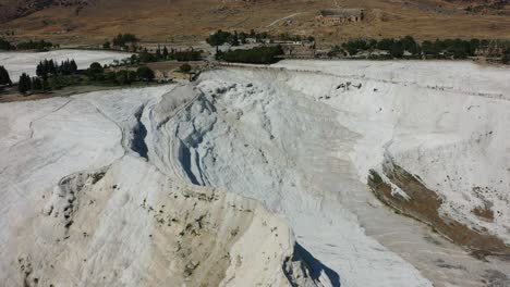 aerial top down view of a unique white mineral rich mountain in pamukkale turkey famous for its thermal pools