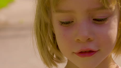 Close-up-portrait-of-a-beautiful,-blue-eyed,-little-girl