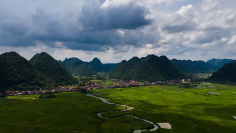 stunning aerial view of a picturesque village nestled in a lush green valley