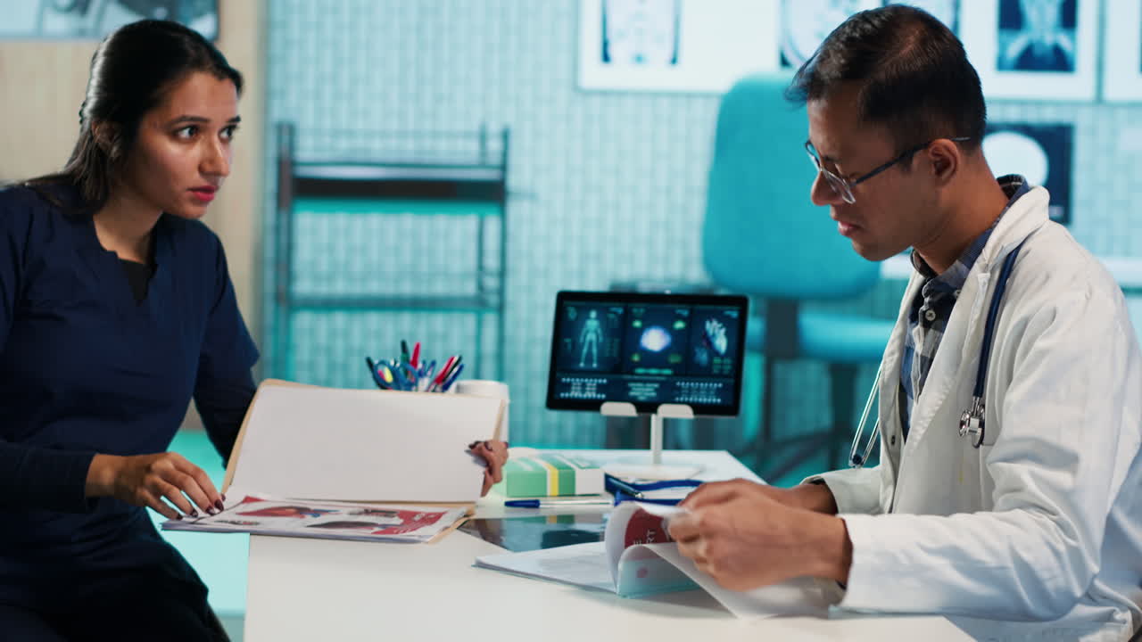 Medical professionals discussing patient information in a clinic