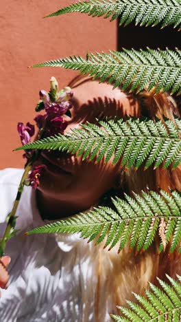 woman and flowers in ferns