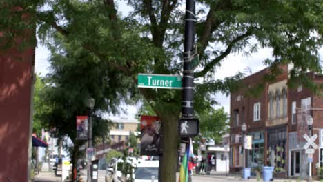 turner street road sign in lansing, michigan old town with stable establishing video shot pulling focus and in slow motion