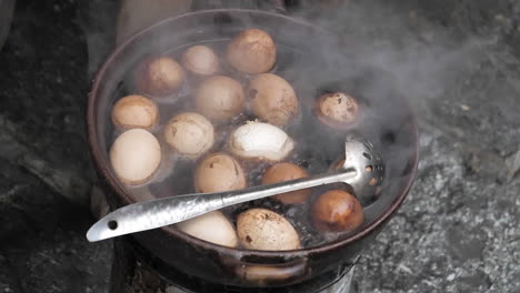 Slow-Motion-Eggs-Boiling-in-Water-Chinese-Market-in-Lijiang,-Yunnan,-China