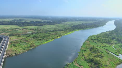 aerial view of big river with greenery landscape along the riverbank