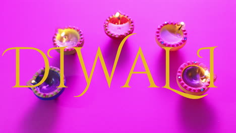 animation of diwali text over candles on purple background