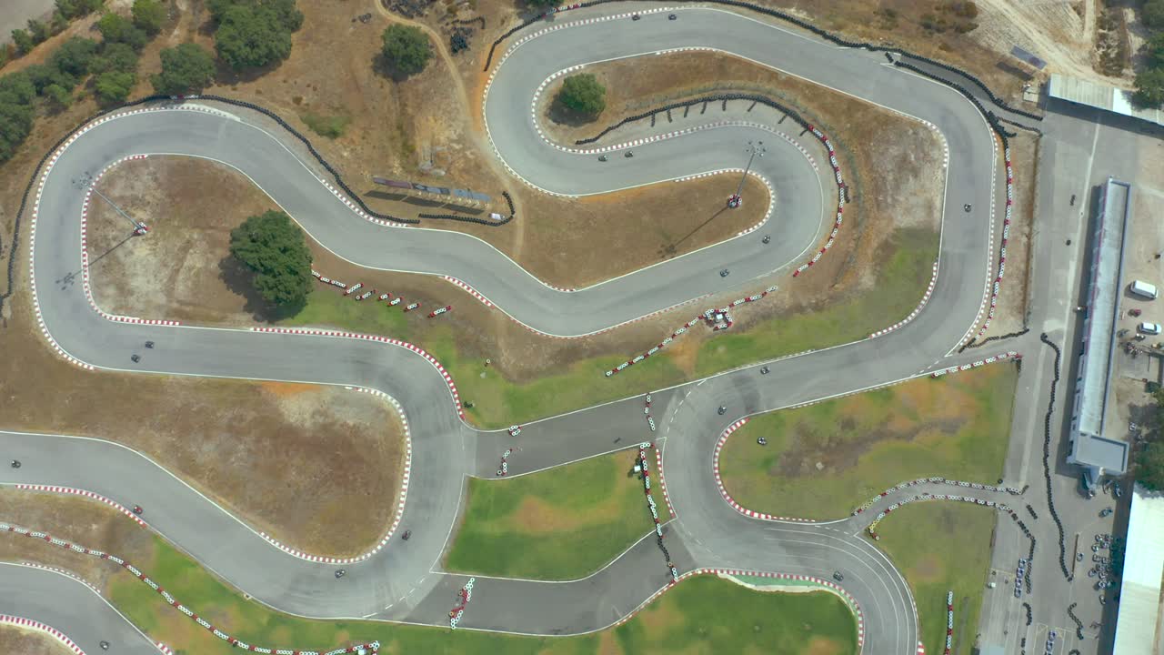 Overhead aerial of a go kart race track, cenital shot of racing karting hobby, above view of a motorsport circuit