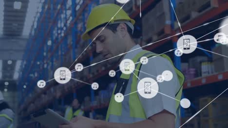 Animation-of-network-of-connections-with-icons-over-caucasian-male-worker-in-warehouse