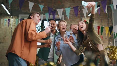 office colleagues making selfie holding champagne glasses. smiling business team