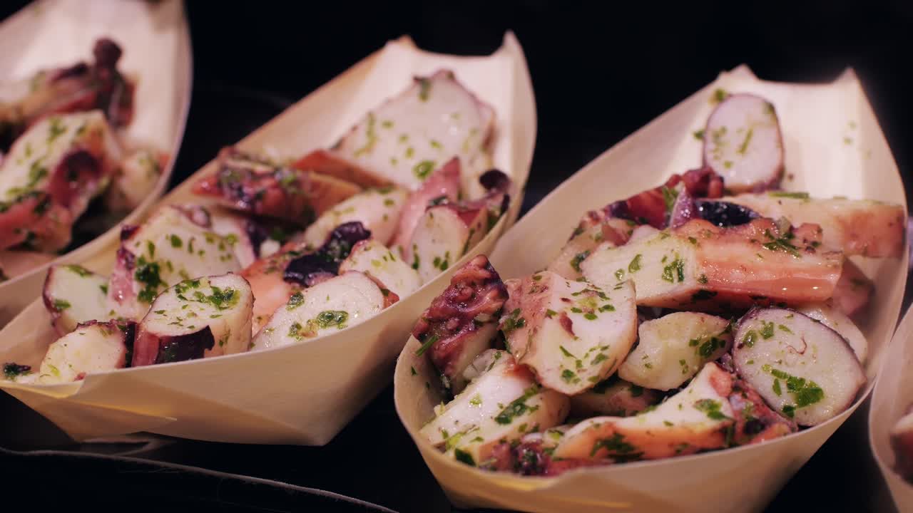 Savor a tasty seafood salad with herbs in bamboo boats at a stylish upscale restaurant, beautifully presented