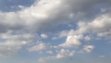 Mid-afternoon-thunderstorm-rain-clouds-forming-and-blending-across-the-african-horizon-time-lapse,-noise-free-4k-footage