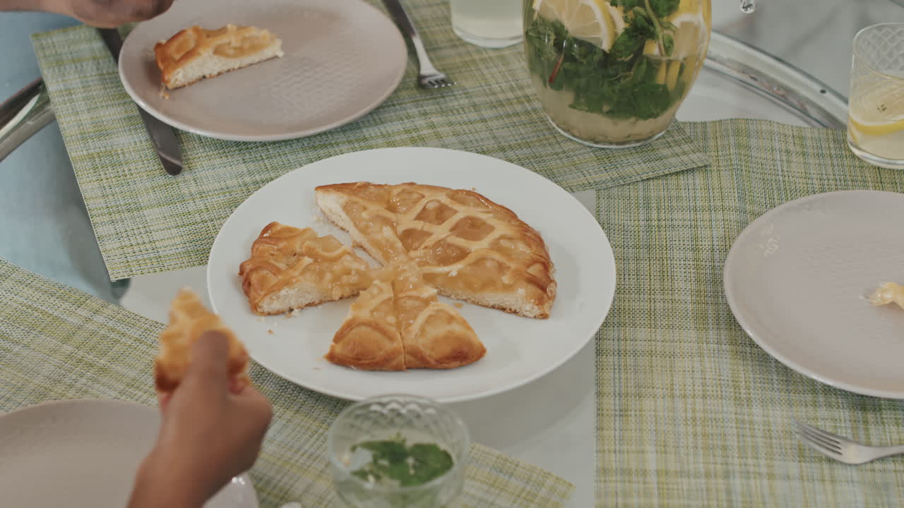 Hands Taking Pieces of Apple Pie