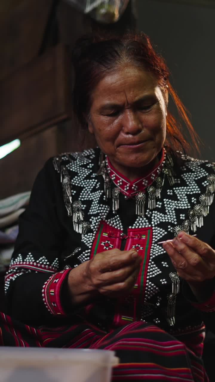 Woman in Traditional Clothing Crafting