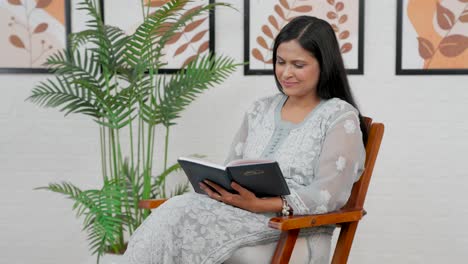 Woman-thinking-after-reading-book