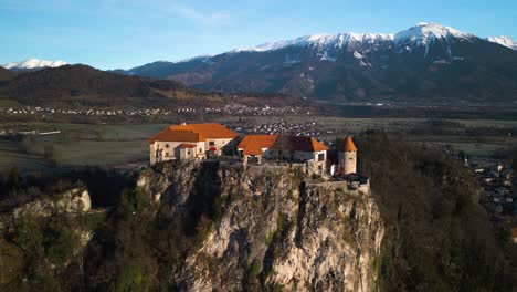 orbiting drone shot above medieval bled castle in slovenia